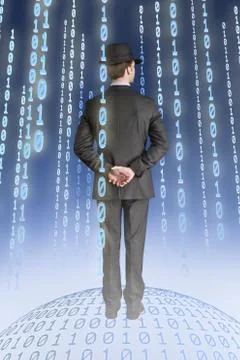 Businessman standing on binary globe with binary strings Stock Photos