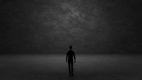 Businessman standing in dark room looking at concrete wall Stock Illustration