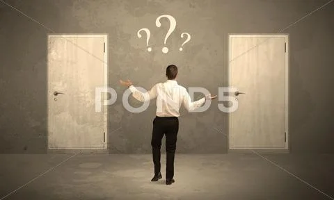 Businessman standing in front of doors Stock Photos
