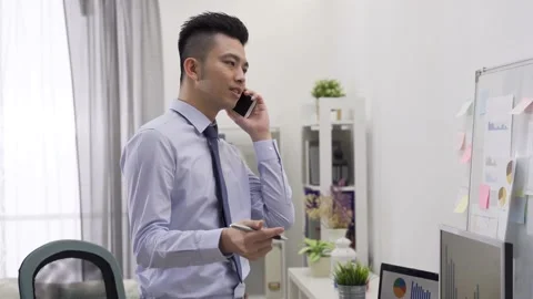 Businessman standing holding pen is explaining Video stock 149074099