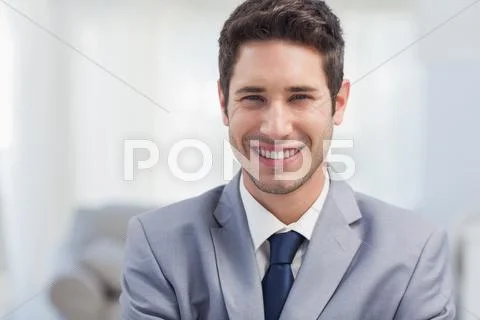 Businessman standing in the living room Stock-Fotos