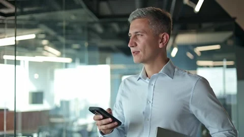 Businessman Standing in Office, Checking his Smartphone Stock-Footage 282170163