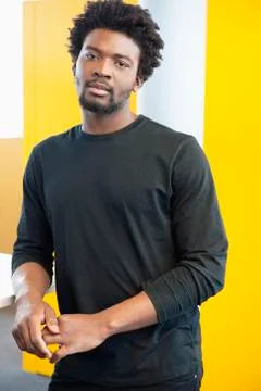 Businessman standing in an office Stock Photos