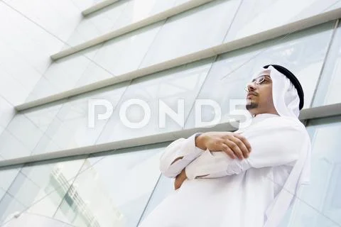 Businessman standing outdoors by building (selective focus) Stock Photos