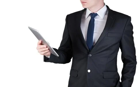 Businessman standing while using tablet computer, isolated on white backgroun Foto stock