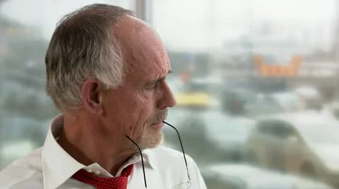 A businessman standing by the window thinking about a problem and a solution Video stock 11298176