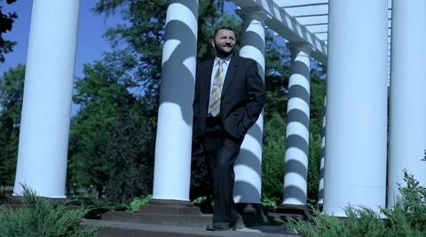 Businessman stands among column and be happy Stock Footage 59089119