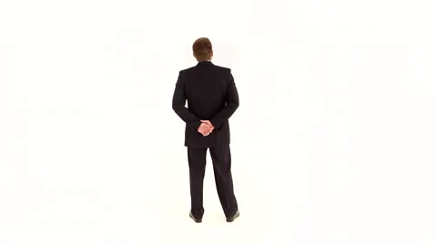 Businessman Stands With His Back on a White Background Stock Footage 57634545