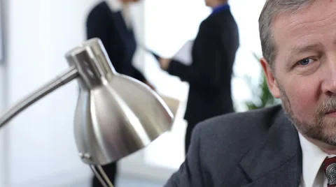 Businessman stares into camera Stock Footage 62279649