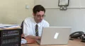 Businessman stares at computer HD Footage