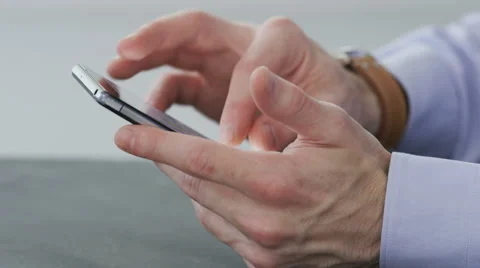 Businessman stops using a mobile phone Stock Footage 68403005