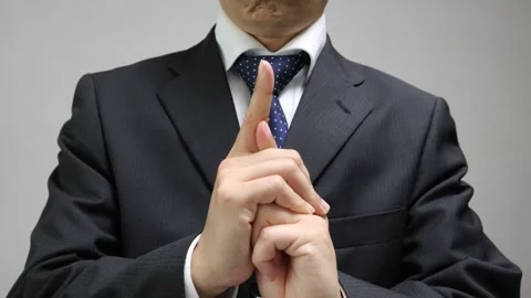 A businessman striking a ninja pose Stock Footage 335668256