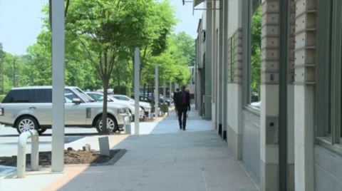 Businessman strolling on sidewalk Video stock 32509654