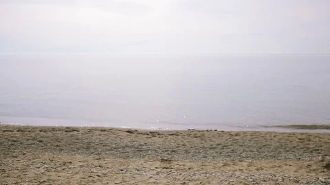 Businessman strolls along the beach in a suit . admires the beautiful beach Stock Footage