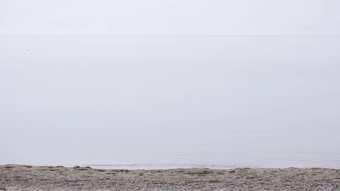 Businessman strolls along the beach in a suit . admires the beautiful beach Stock Footage