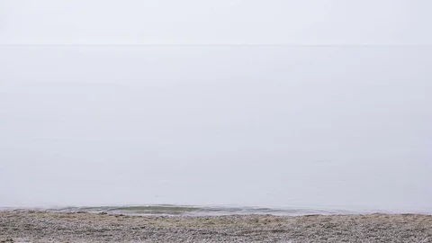 Businessman strolls along the beach in a suit . admires the beautiful beach Stock Footage