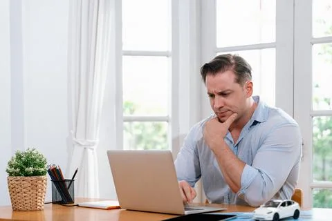 Businessman struggle to solve work problem from home. Synchronos 库存照片