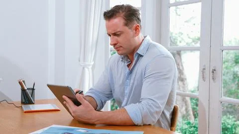 Businessman struggle to solve work problem from home. Synchronos 스톡 사진