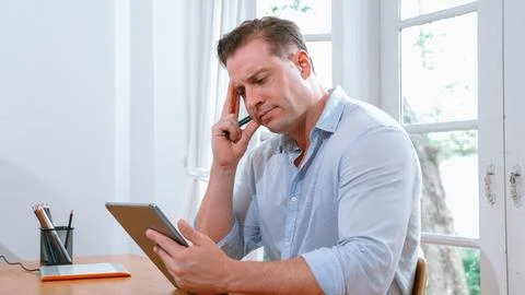 Businessman struggle to solve work problem from home. Synchronos 스톡 사진