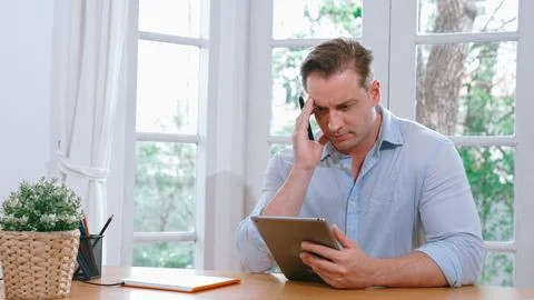 Businessman struggle to solve work problem from home. Synchronos 스톡 사진