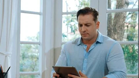 Businessman struggle to solve work problem from home. Synchronos 스톡 사진