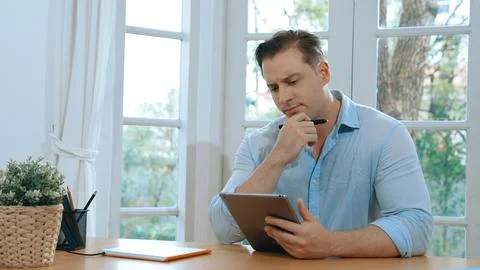 Businessman struggle to solve work problem from home. Synchronos 库存照片