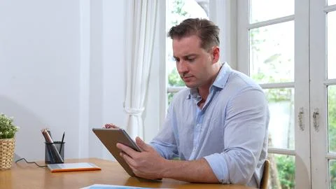 Businessman struggle to solve work problem from home. Synchronos 스톡 사진