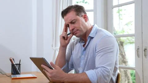 Businessman struggle to solve work problem from home. Synchronos 스톡 사진