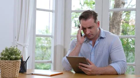 Businessman struggle to solve work problem from home. Synchronos 스톡 사진