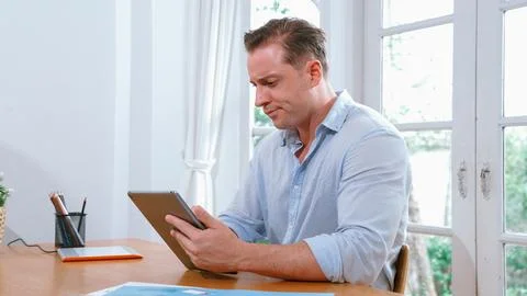 Businessman struggle to solve work problem from home. Synchronos 스톡 사진