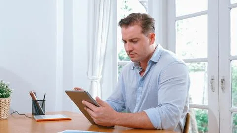 Businessman struggle to solve work problem from home. Synchronos 스톡 사진