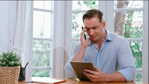 Businessman struggle to solve work problem from home. Synchronos 스톡 사진