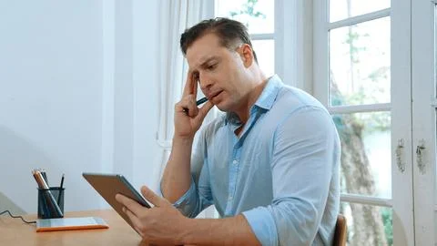 Businessman struggle to solve work problem from home. Synchronos 스톡 사진