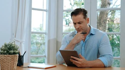 Businessman struggle to solve work problem from home. Synchronos 스톡 사진