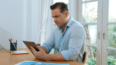 Businessman struggle to solve work problem from home. Synchronos 스톡 사진