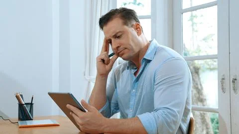 Businessman struggle to solve work problem from home. Synchronos 스톡 사진