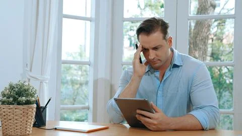 Businessman struggle to solve work problem from home. Synchronos 스톡 사진