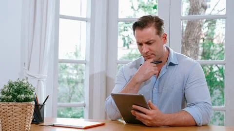 Businessman struggle to solve work problem from home. Synchronos 스톡 사진