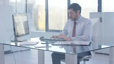 Businessman studying business graph on computer in office Stock Footage 107613998