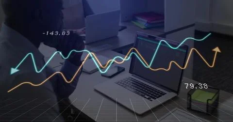 Businessman studying coded data on laptop at office, with line-graph overlay, Stock Photos