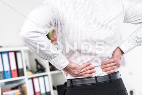 Businessman suffering from back pain Stock Photos