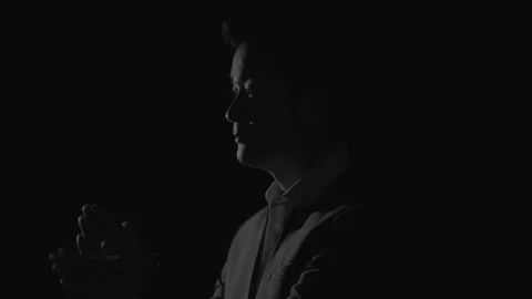 Businessman in Suit Clapping Hands in Profile Silhouette Against Dark Background Видео 336546072