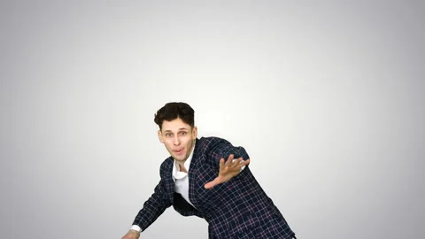 Businessman in suit does break dance moves on gradient background. Stock-Footage 130699701
