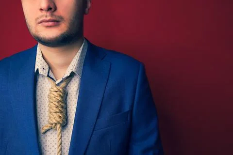 Businessman in suit with Lynch loop instead of tie over neck. Stock Photos