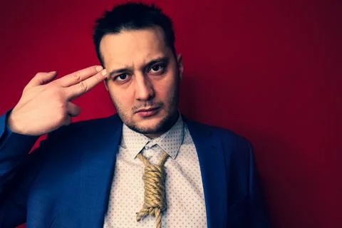 Businessman in suit with Lynch loop instead of tie over neck. Stock Photos