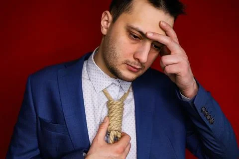 Businessman in suit with Lynch loop instead of tie over neck. Stock Photos