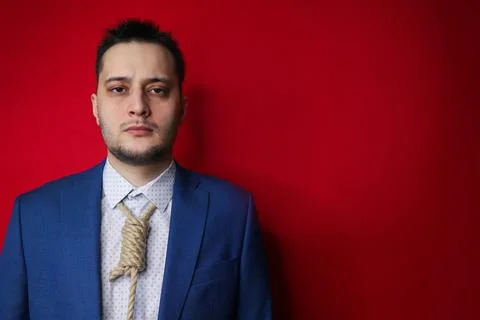 Businessman in suit with Lynch loop instead of tie over neck. Stock Photos