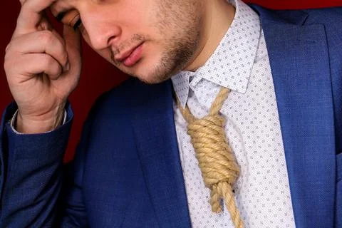 Businessman in suit with Lynch loop instead of tie over neck. Stock Photos