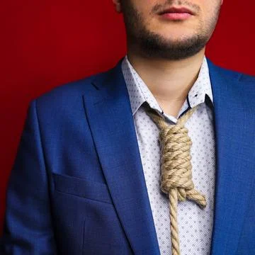 Businessman in suit with Lynch loop instead of tie over neck. Stock Photos