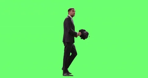 Businessman in a Suit Opens Umbrella While Walking. Shot on Mock-up Green Screen Stock Footage 77292813